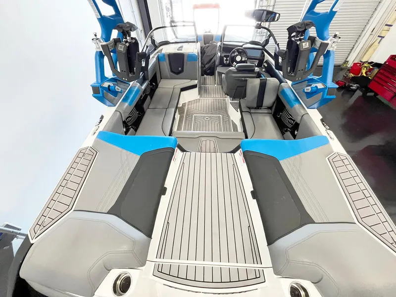 Slide: The Image of 2020 Nautique G21 boat interior with blue and gray seating, modern design. - 9