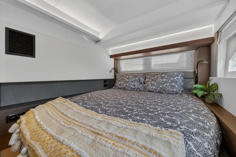 Slide: The Image of Luxurious bedroom interior of 2022 Leopard 53 Powercat yacht with elegant bedding. - 102