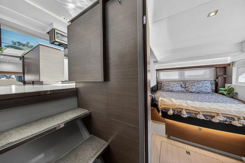 Slide: The Image of Interior of 2022 Leopard 53 Powercat featuring modern kitchen and cozy bedroom. - 108