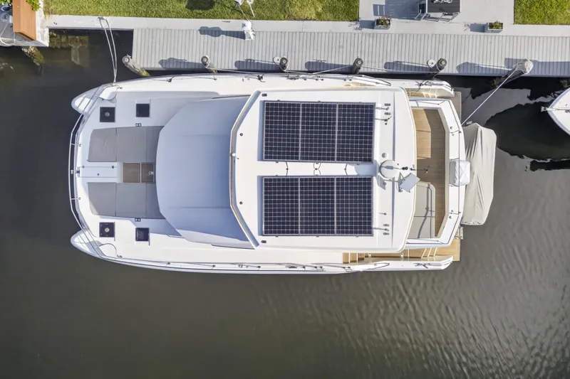 Slide: The Image of Aerial view of 2022 Leopard 53 Powercat yacht with solar panels docked at marina. - 11