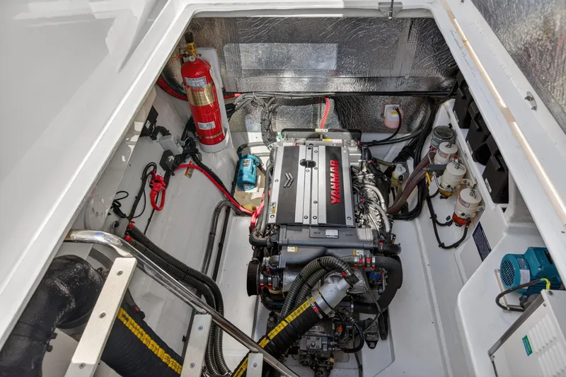 Slide: The Image of Engine compartment of 2022 Leopard 53 Powercat with Yanmar engine and fire extinguisher. - 116