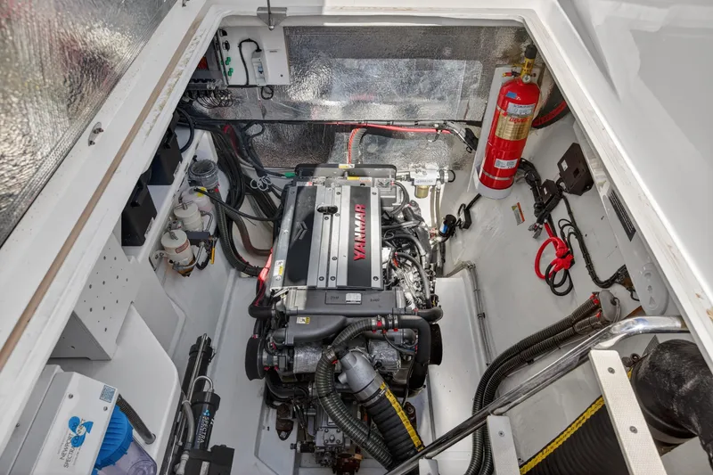 Slide: The Image of Engine room of 2022 Leopard 53 Powercat featuring Yanmar engine and safety equipment. - 122