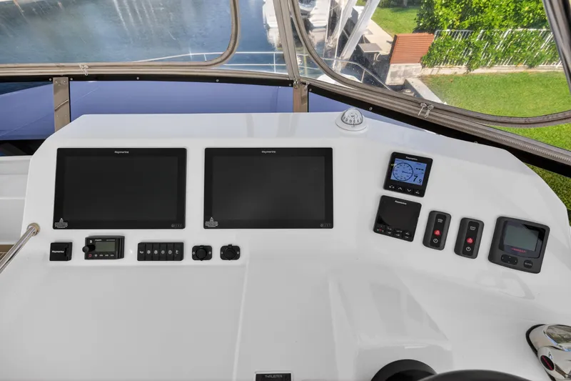 Slide: The Image of Control panel of 2022 Leopard 53 Powercat with navigation screens and instruments. - 15