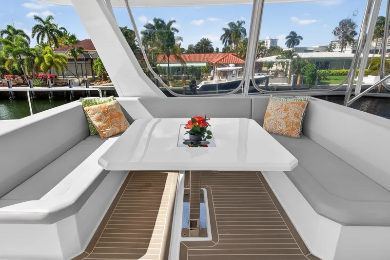 Slide: The Image of Luxurious seating area on 2022 Leopard 53 Powercat yacht with elegant table and cushions. - 20