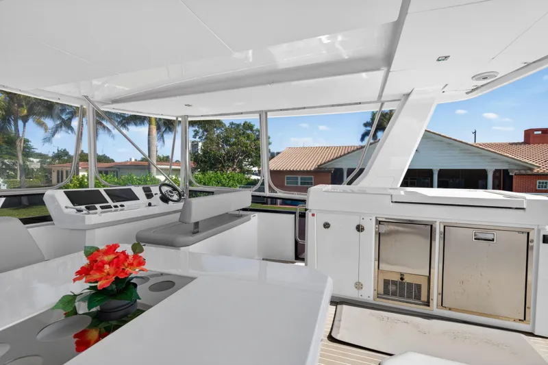 Slide: The Image of Luxurious interior of 2022 Leopard 53 Powercat yacht with modern helm and vibrant floral decor. - 22