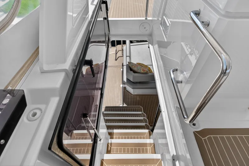 Slide: The Image of Staircase view inside 2022 Leopard 53 Powercat yacht, featuring sleek design and modern finishes. - 29