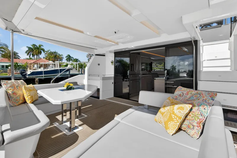 Slide: The Image of Luxurious 2022 Leopard 53 Powercat yacht interior with elegant seating and vibrant cushions. - 31