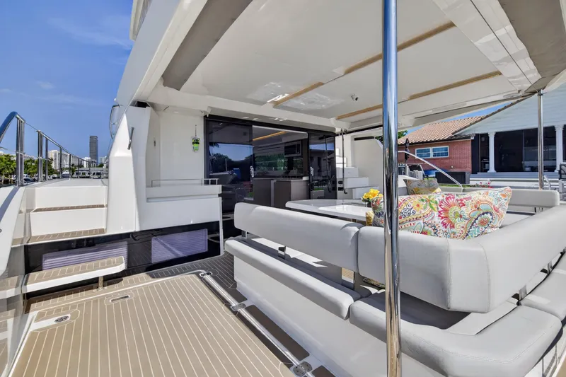 Slide: The Image of Luxurious 2022 Leopard 53 Powercat yacht with spacious outdoor seating and elegant design. - 34