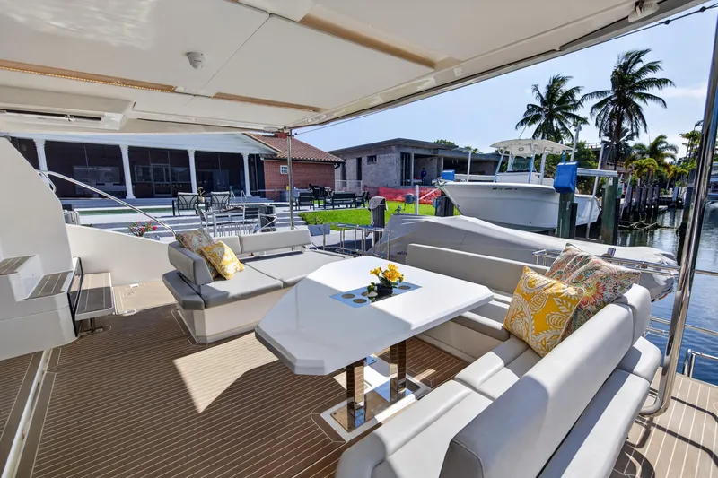 Slide: The Image of Luxurious 2022 Leopard 53 Powercat yacht interior with elegant seating and waterfront view. - 38