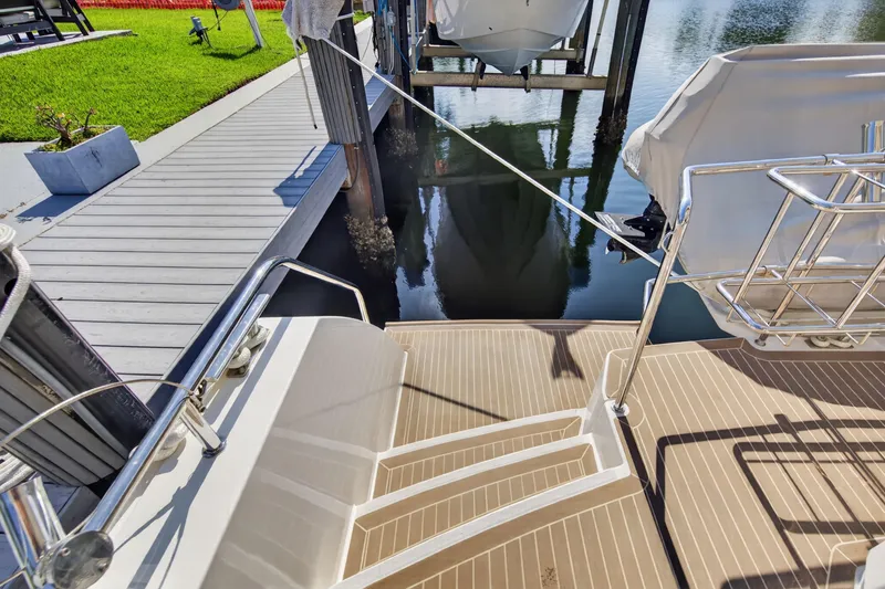 Slide: The Image of Leopard 53 Powercat 2022 docked, showing deck and marina view. - 40