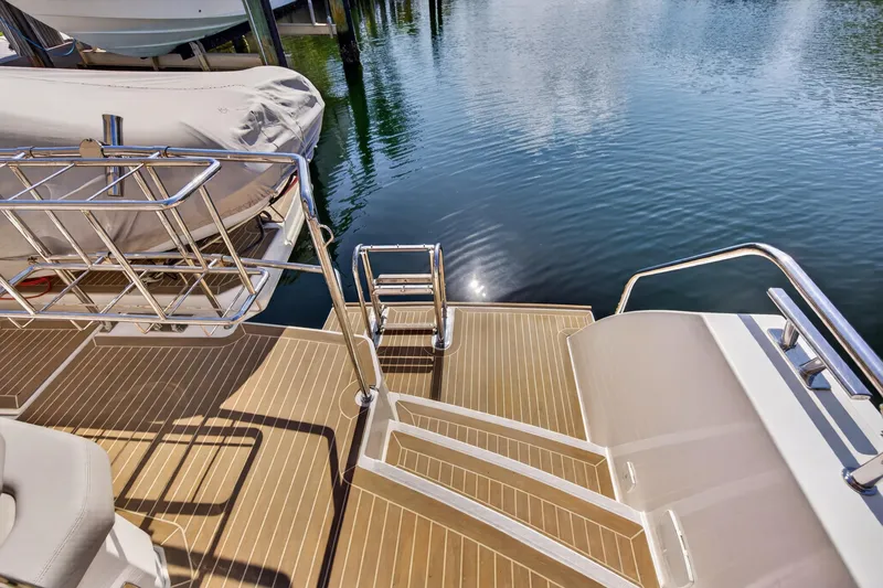 Slide: The Image of Sleek deck of 2022 Leopard 53 Powercat yacht with water reflection. - 41
