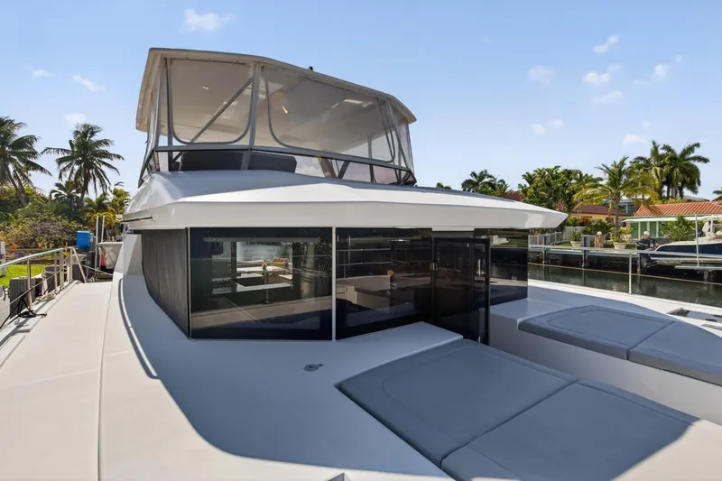 Slide: The Image of 2022 Leopard 53 Powercat yacht docked, featuring spacious deck and modern design. - 49
