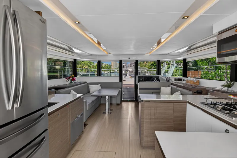 Slide: The Image of Luxurious interior of 2022 Leopard 53 Powercat yacht with modern kitchen and seating area. - 54