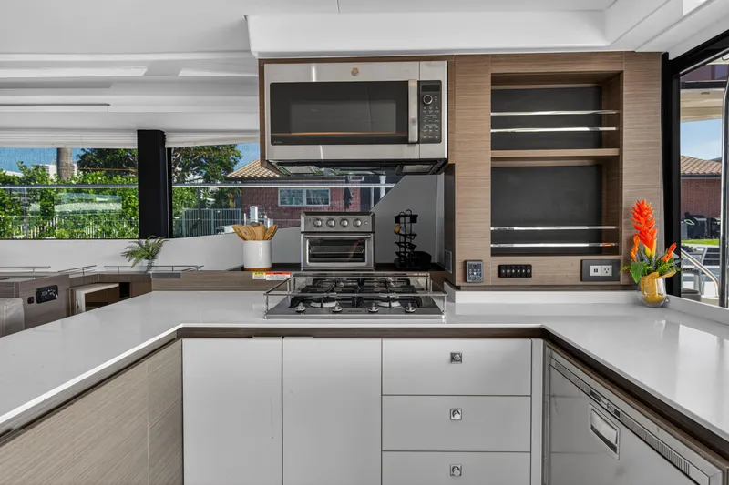 Slide: The Image of Modern kitchen interior on 2022 Leopard 53 Powercat yacht, featuring sleek appliances and elegant design. - 56
