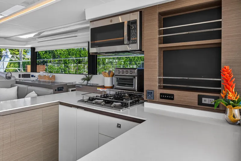 Slide: The Image of Modern kitchen interior on 2022 Leopard 53 Powercat yacht, featuring sleek appliances and elegant design. - 57