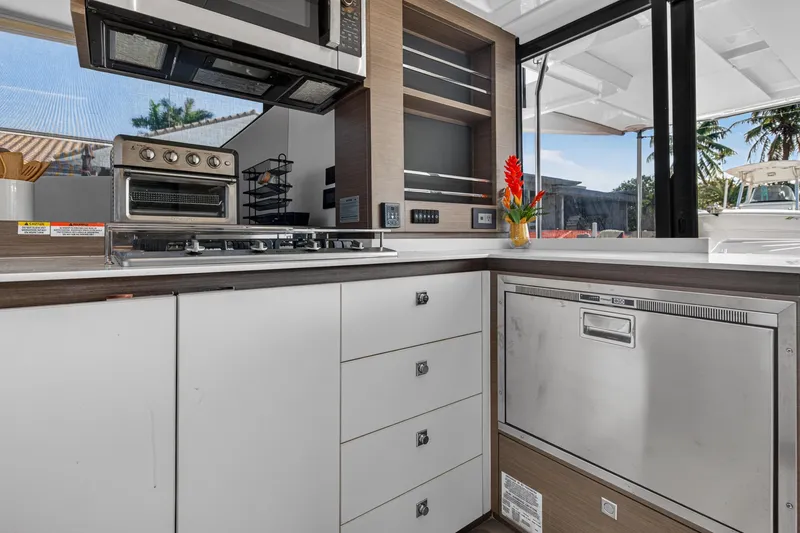 Slide: The Image of Modern kitchen interior of 2022 Leopard 53 Powercat yacht with appliances and sleek cabinetry. - 59