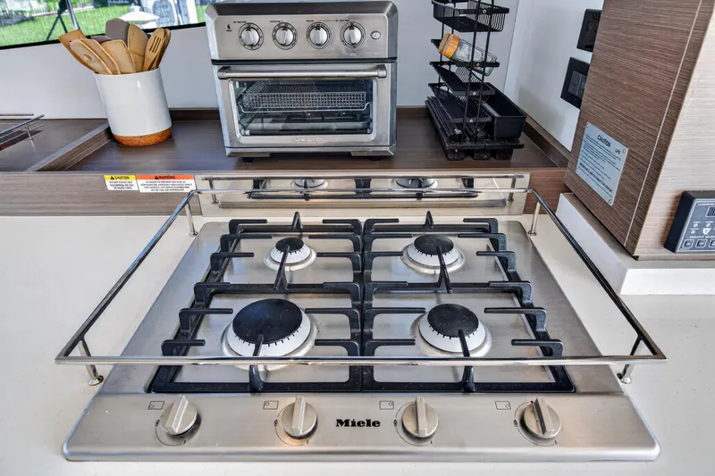 Slide: The Image of Modern kitchen with Miele gas stove and oven on Leopard 53 Powercat, 2022 model. - 62