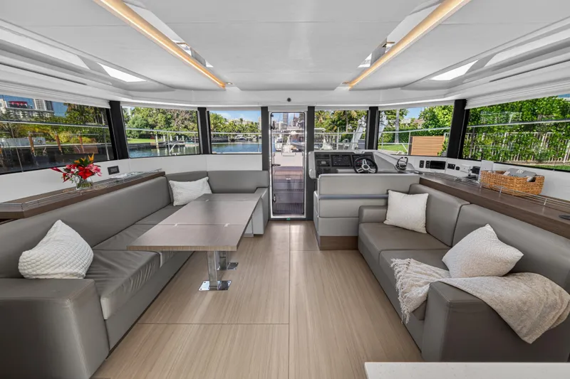 Slide: The Image of Luxurious interior of 2022 Leopard 53 Powercat yacht with modern seating and large windows. - 67