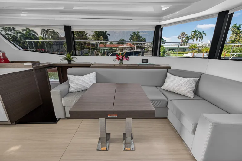 Slide: The Image of Luxurious interior of 2022 Leopard 53 Powercat yacht with modern seating and table. - 72
