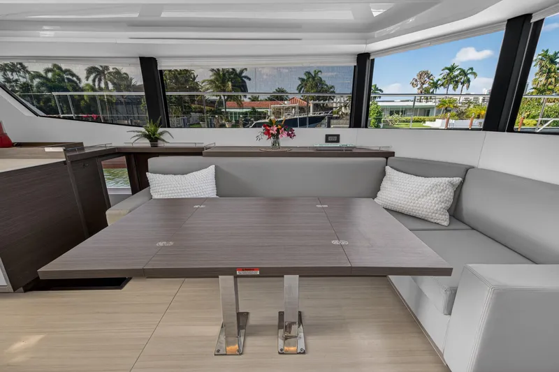 Slide: The Image of Luxurious interior of 2022 Leopard 53 Powercat yacht with modern seating and table. - 73