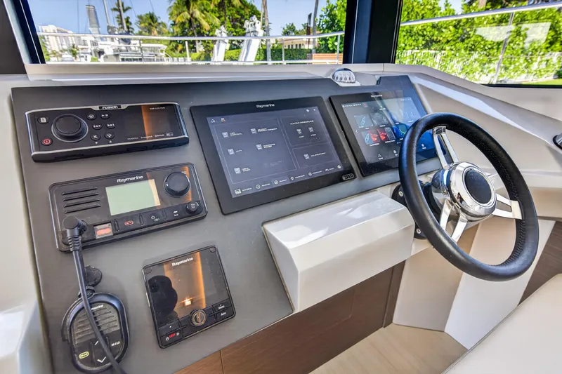 Slide: The Image of Control panel of 2022 Leopard 53 Powercat featuring advanced navigation and communication systems. - 75