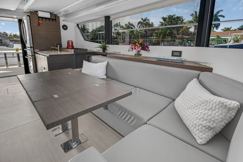 Slide: The Image of Luxurious interior of 2022 Leopard 53 Powercat yacht with modern seating and dining area. - 80