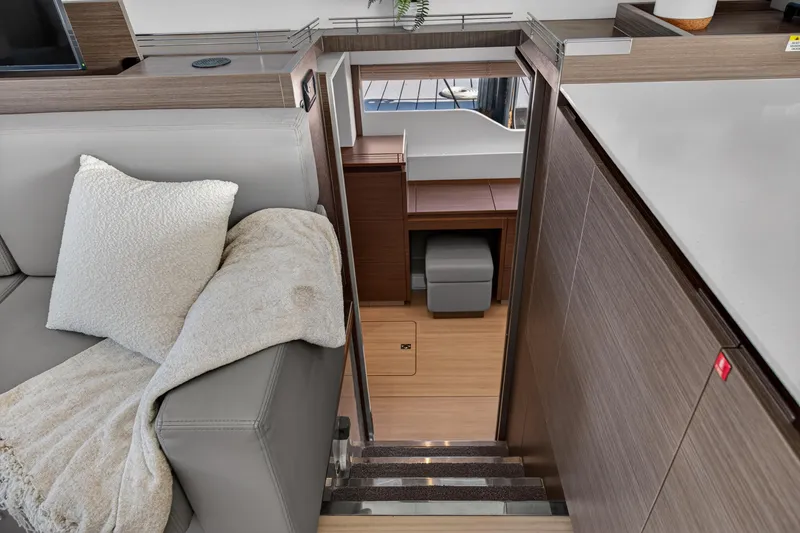 Slide: The Image of Interior of 2022 Leopard 53 Powercat yacht, featuring modern design and cozy seating area. - 86