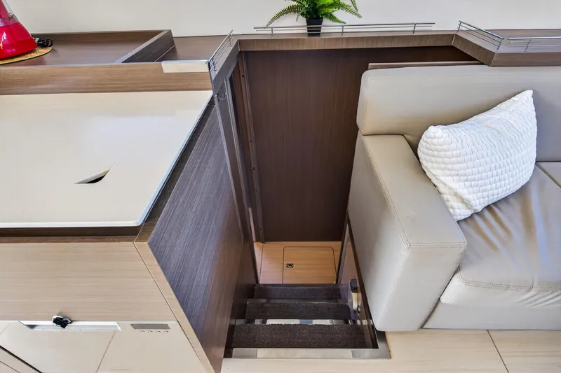 Slide: The Image of Interior of 2022 Leopard 53 Powercat yacht, featuring stairs and modern seating area. - 87
