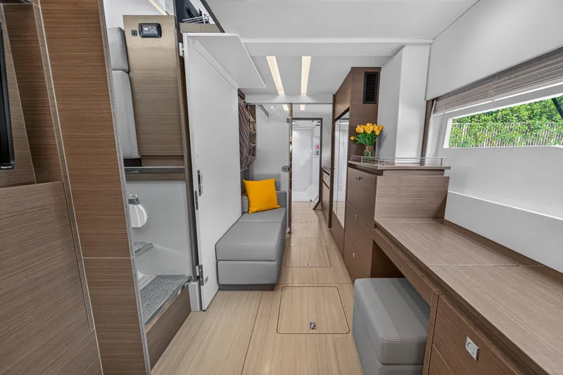 Slide: The Image of Modern interior of 2022 Leopard 53 Powercat yacht with sleek wood finishes and cozy seating. - 88