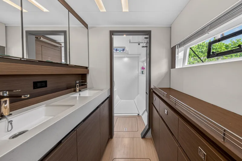 Slide: The Image of Luxurious bathroom interior of 2022 Leopard 53 Powercat yacht with modern fixtures and ample storage. - 94