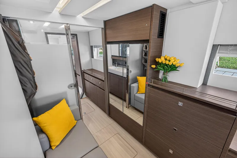 Slide: The Image of Luxurious interior of 2022 Leopard 53 Powercat with modern design and yellow accents. - 95