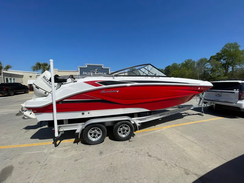Slide: The Image of 2020 Hurricane SD235 boat in red on a trailer at Angler's Marine. - 0