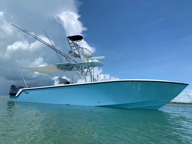 The Image of 2020 SeaVee 340Z boat on calm water under a cloudy sky. - 0