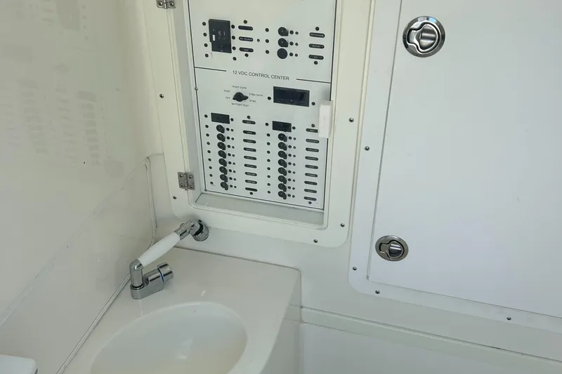 Slide: The Image of 2020 SeaVee 340Z boat interior with control panel and sink. - 3