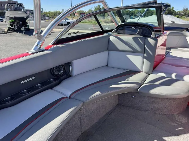 Slide: The Image of 2009 Supra 21V LAUNCH boat interior with gray seating and cup holders. - 3