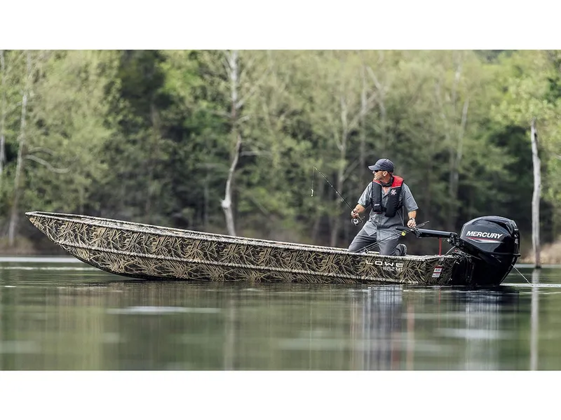 Slide: The Image of Manufacturer Provided Image: Man fishing on a 2025 Lowe Jon L1852MT boat in a serene lake setting. - 11