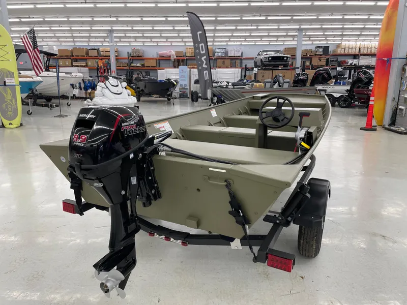 Slide: The Image of 2025 Lowe Jon L1852MT boat with Mercury outboard motor in showroom. - 3