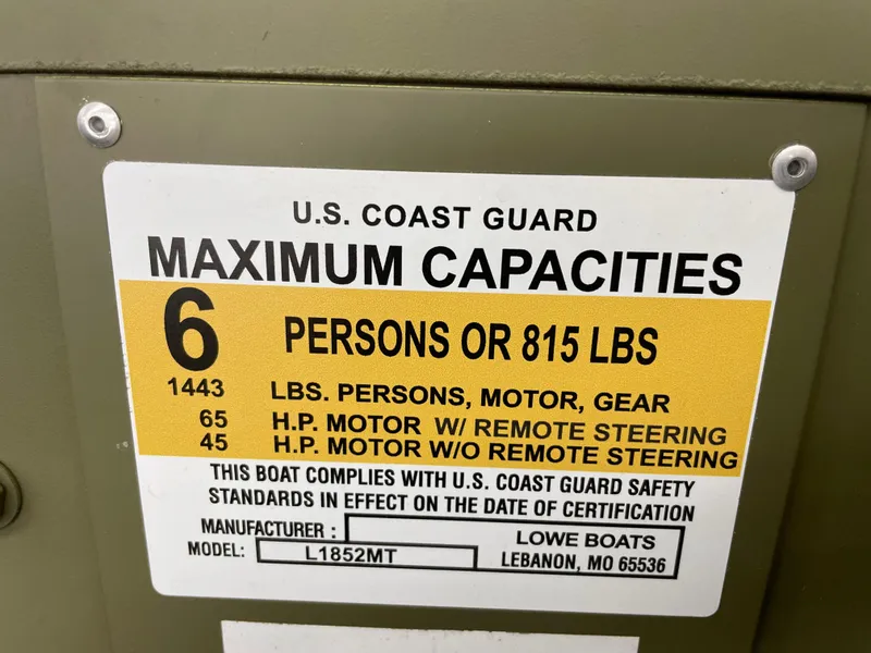 Slide: The Image of U.S. Coast Guard capacity label for Lowe Jon L1852MT, 2025 model, 6 persons or 815 lbs. - 8