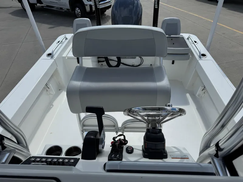 Slide: The Image of 2020 Bay Rider 239 Bay boat interior with steering wheel and seating. - 13
