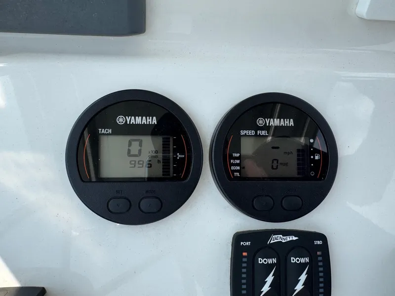 Slide: The Image of Yamaha tachometer and speed fuel gauges on 2020 Bay Rider 239 Bay boat dashboard. - 14