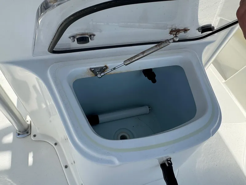 Slide: The Image of Open storage compartment on a 2020 Bay Rider 239 Bay boat. - 20