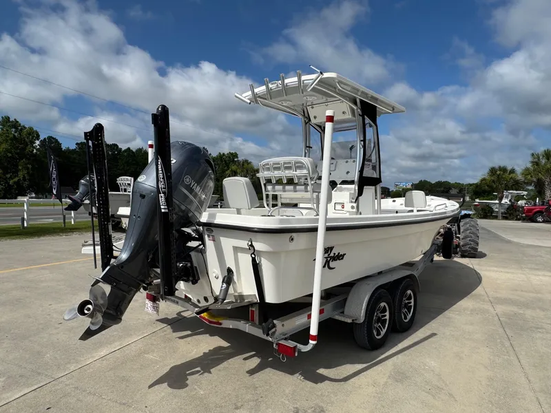 Slide: The Image of 2020 Bay Rider 239 Bay boat on trailer, featuring Yamaha outboard motor, parked outdoors. - 3