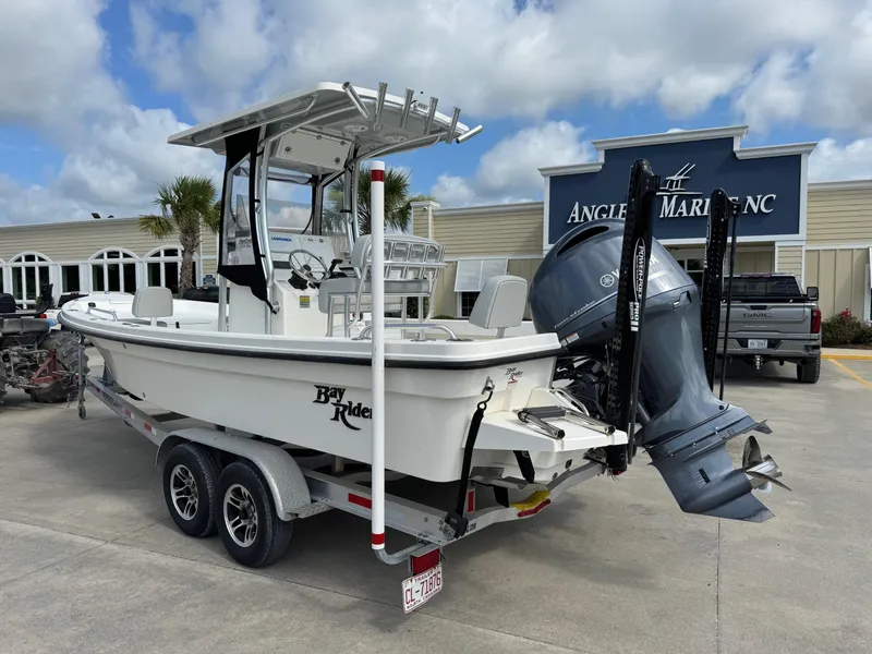 Slide: The Image of 2020 Bay Rider 239 Bay boat on trailer at Angler's Marine dealership. - 4