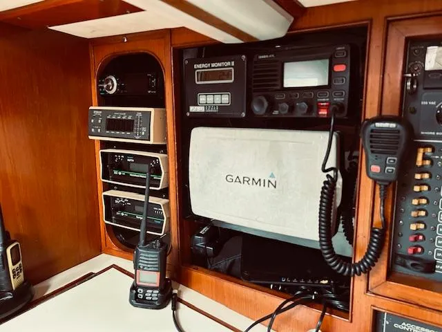 Slide: The Image of 1983 Stevens 40 yacht navigation panel with Garmin GPS and communication devices. - 12