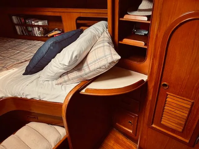 Slide: The Image of Cozy cabin interior of 1983 Stevens 40 yacht with wooden shelves and bed. - 22