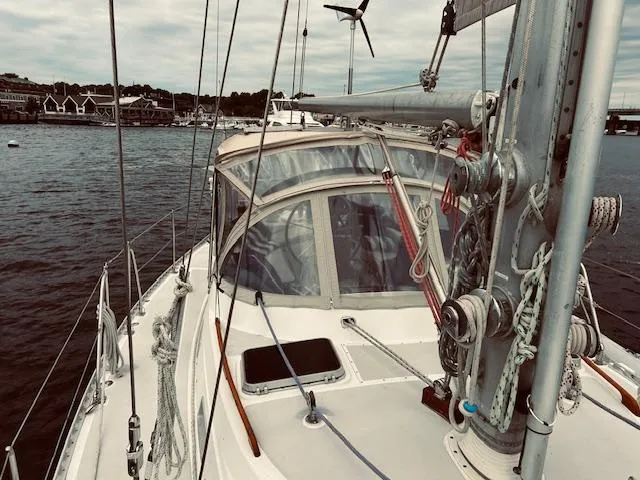 Slide: The Image of 1983 Stevens 40 sailboat on calm water, featuring rigging and deck details. - 31