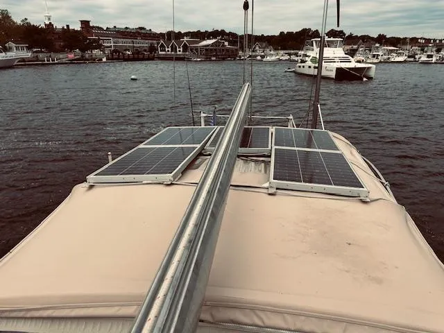 Slide: The Image of Sailboat with solar panels docked at marina, Stevens 40, 1983 model. - 35