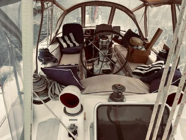 Slide: The Image of Cockpit of 1983 Stevens 40 sailboat with cushions and nautical equipment. - 36