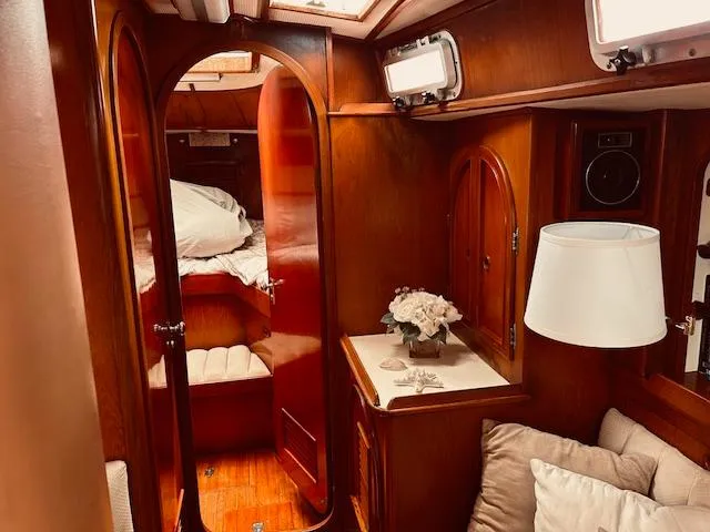 Slide: The Image of Luxurious 1983 Stevens 40 yacht interior with wood finish and cozy cabin. - 9