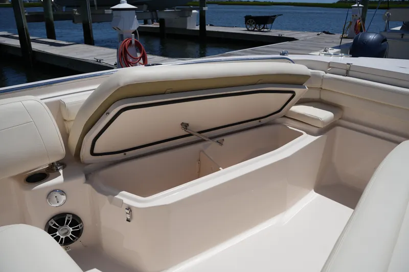 Slide: The Image of 2022 Grady-White Fisherman 257 boat with open storage compartment at dock. - 35